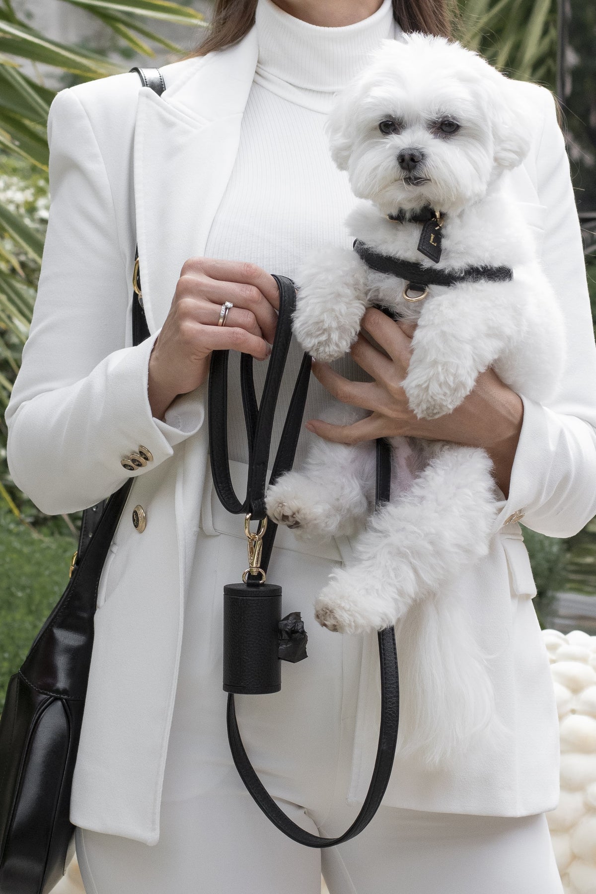 Yara, founder of Tesoro Collezione, walking her dog